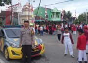 Polsek Pangkajene Amankan Gerak Jalan Santai HUT RI ke-80 di Kp. Sanrangan